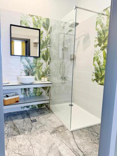 a bathroom with a shower and a sink at Ambar Hotel in Giurgiu