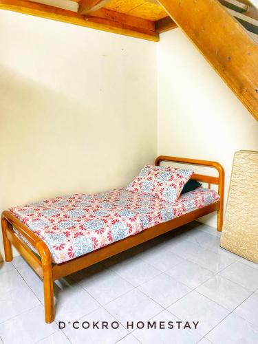 a bed sitting in a room with at Dchokro Homestay Parit Raja UTHM in Parit Raja