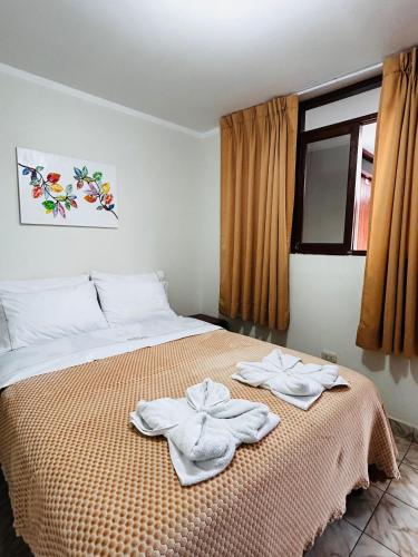 Ένα ή περισσότερα κρεβάτια σε δωμάτιο στο Hostal El Gran Gocta