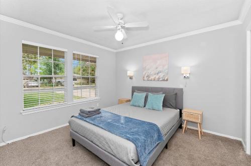 a bedroom with a bed and a ceiling fan at Pet Friendly - Q2 & Domain - King Bed - Pool Table in Austin