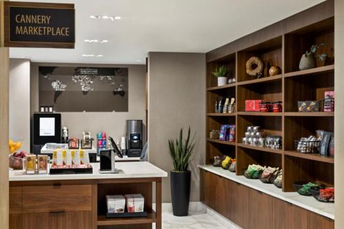 a coffee shop with a counter and shelves at Crowne Plaza Toronto Airport by IHG in Toronto