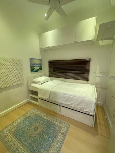 Ένα ή περισσότερα κρεβάτια σε δωμάτιο στο Camellia Guesthome Cyberjaya