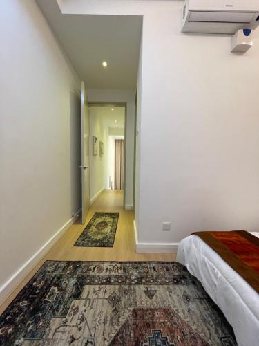 Ένα ή περισσότερα κρεβάτια σε δωμάτιο στο Camellia Guesthome Cyberjaya