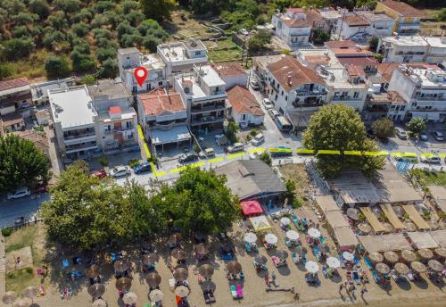 an overhead view of a city with a lot of umbrellas at MarGio Bay in Limenas
