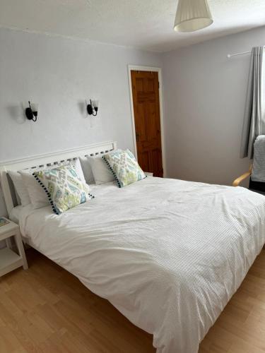 Postel nebo postele na pokoji v ubytování Chapel Cottage