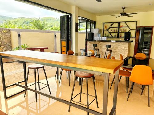a dining room with a table and chairs at patong v hotel in Patong Beach