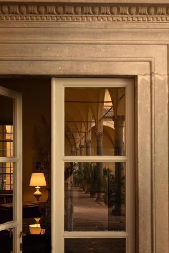 a reflection of a staircase in a window at Hotel Certosa Di Maggiano in Siena