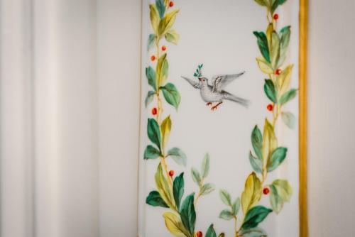 a picture of a bird flying in front of a wall at Dun Brae Cottage in Dornoch