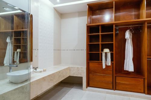 a bathroom with a tub and a sink and a shower at La Dulce Vista Hotel & Villas - Sierra Madre Puerto Vallarta in Puerto Vallarta