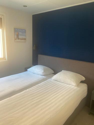 Ένα ή περισσότερα κρεβάτια σε δωμάτιο στο Het Paalhoofd 3 personen