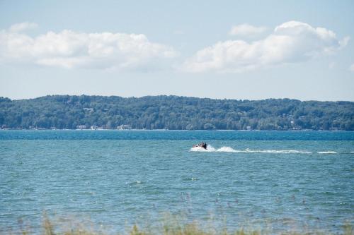 a person on a jet ski in the water at Kasa Gold Coast Inn Traverse City in Traverse City