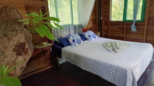 Postel nebo postele na pokoji v ubytování Playa Grande Lodge & Tree House