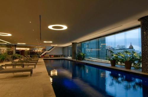 a hotel with a swimming pool in a building at 3 BR Upscale Art House Reforma Avenue in Mexico City