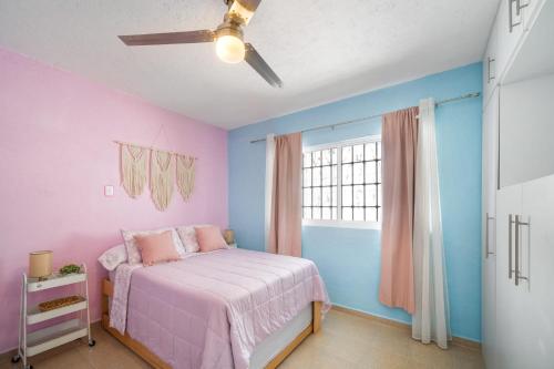 Cama o camas de una habitación en 3BR Casa familiar con alberca y asador en Oaxtepec
