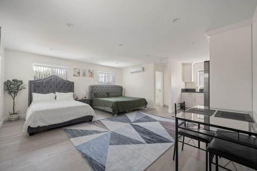 a bedroom with a bed and a table in it at Prime new beautiful studio in burbank in Burbank