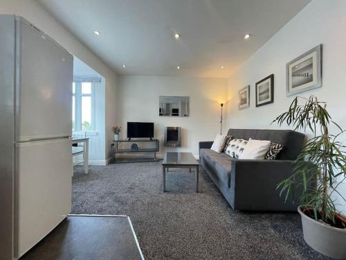 a living room with a couch and a table at Kingsbury Apt 2 in Birmingham