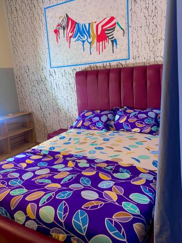 Postel nebo postele na pokoji v ubytování Résidence Togoliving