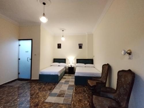 Postel nebo postele na pokoji v ubytování El Khalil Pyramids View Inn