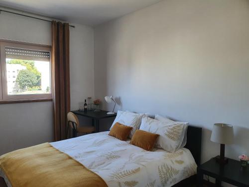 a bedroom with a bed with white sheets and a window at BEST OF NATURE 1, Matosinhos beach, Porto city parc, METRO in Matosinhos