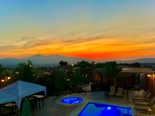 a view of a sunset from the roof of a house at Casa Naiyari in Tepic