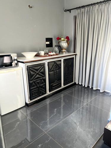 a kitchen with a counter top in a room at The Concept in Centurion