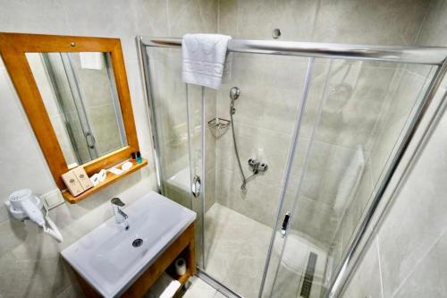 a bathroom with a shower and a sink at Sultan Hamit Hotel in Istanbul