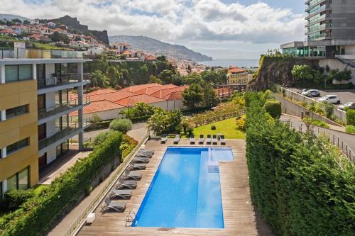 an overhead view of a swimming pool on a building at Piscina fantástica no centro da cidade! in Funchal