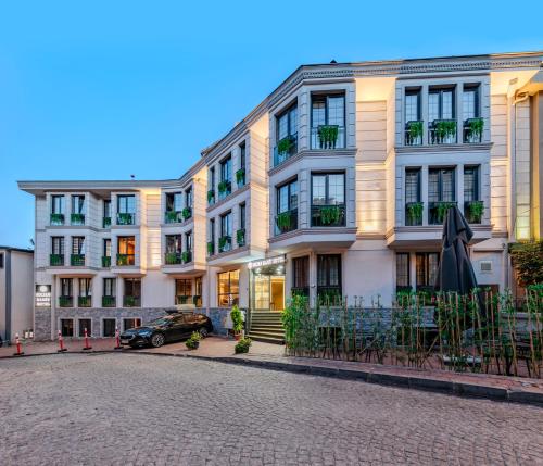 a row of buildings on a cobblestone street at Sultan Hamit Hotel in Istanbul