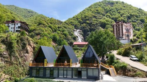 a house on the side of a mountain at AĞARAN Wooden Houses 2 in Cayeli