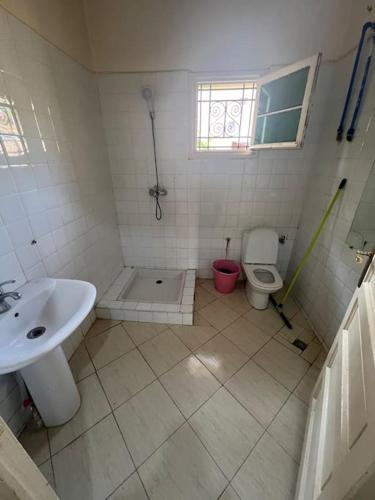 a bathroom with a sink and a toilet at Villa pour Location de Vacances in Imouzzer Kandar