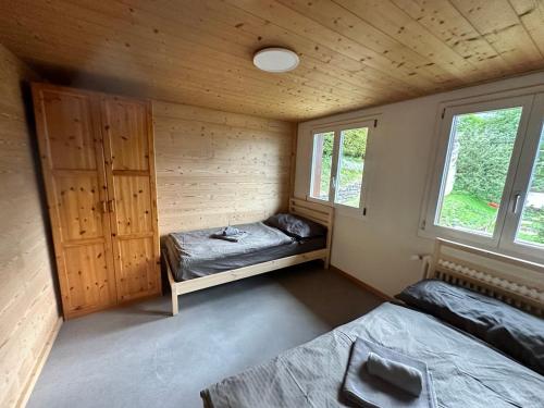 Postel nebo postele na pokoji v ubytování Chalet Luegistal
