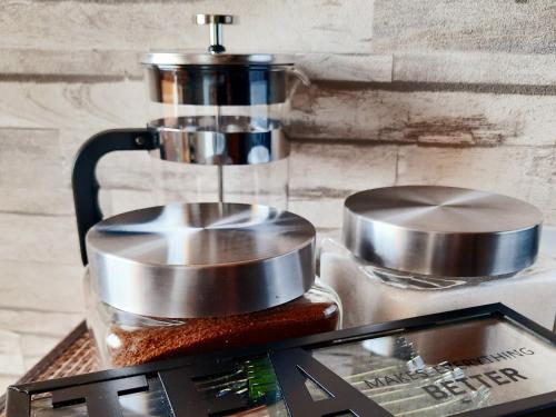 a counter with a coffee maker on top at Between Lake and Sea in Liepāja