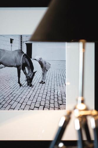 a horse is standing on a brick street at Mandarin Oriental, Hong Kong in Hong Kong