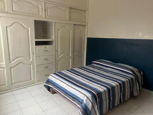 Una cama o camas en una habitación de Hostal Reforma