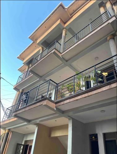 a large building with balconies on top of it at Casa Homes Apt2 with unlimited Wi-Fi in Kampala