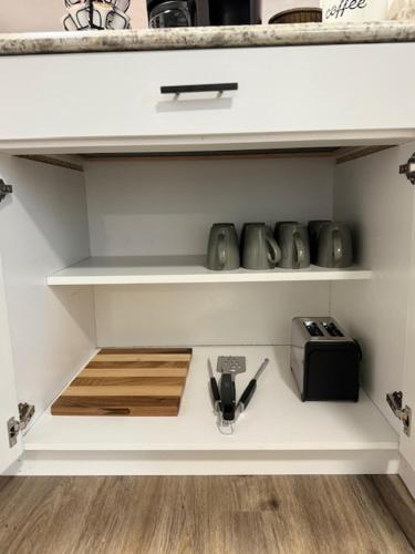 a kitchen shelf with a toaster and a toaster at Red Desert - Wyoming in Rock Springs