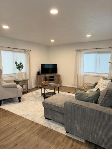 a living room with a couch and a tv at Red Desert - Wyoming in Rock Springs