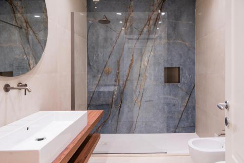 a bathroom with a tub and a sink and a shower at Affittacamere Saint Bon 15 - 5 Terre Rooms and Suites in La Spezia