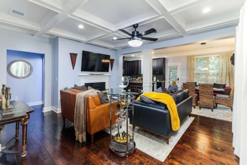 a living room with a couch and a table at Luxury Atlanta Home with King Bed and Yard in Lilburn