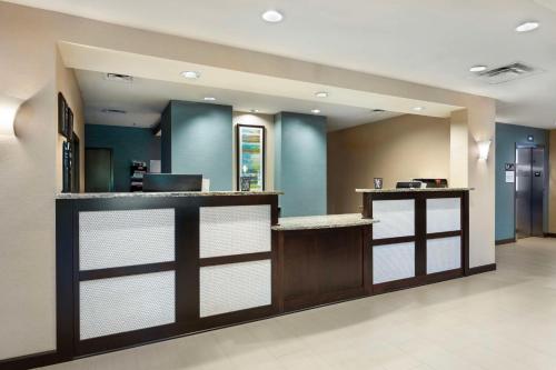 a lobby with a bar with blue walls at Best Western Plus French Lick in French Lick