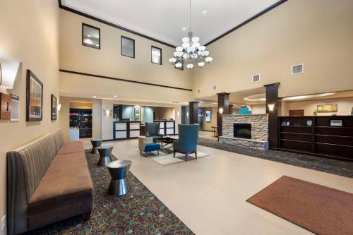 a large living room with a fireplace and furniture at Best Western Plus French Lick in French Lick