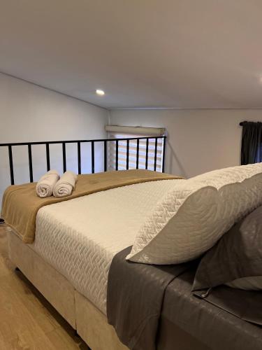 Ein Bett oder Betten in einem Zimmer der Unterkunft Garden's Aparta hotel