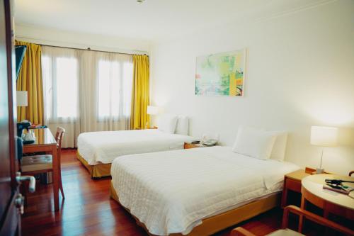 Ένα ή περισσότερα κρεβάτια σε δωμάτιο στο Hotel De La Opera