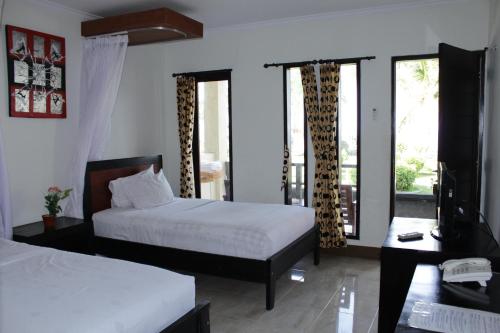 Ένα ή περισσότερα κρεβάτια σε δωμάτιο στο Aman Gati Hotel Lakey
