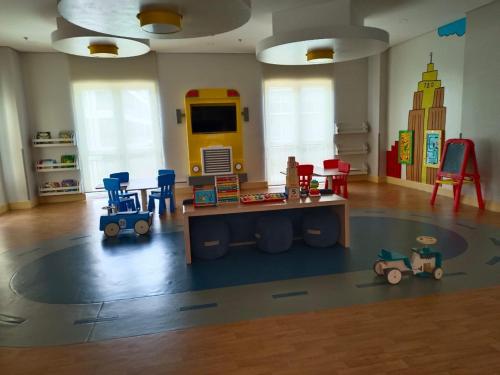 a childs play room with a table and chairs at Newly Opened Cozy Studio Near Airport in Iloilo City