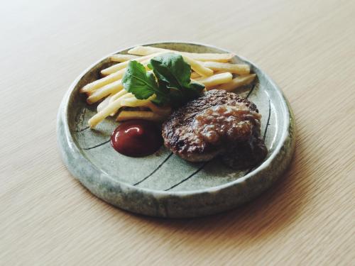 a plate of food with a hamburger and french fries at SOKI ATAMI in Atami