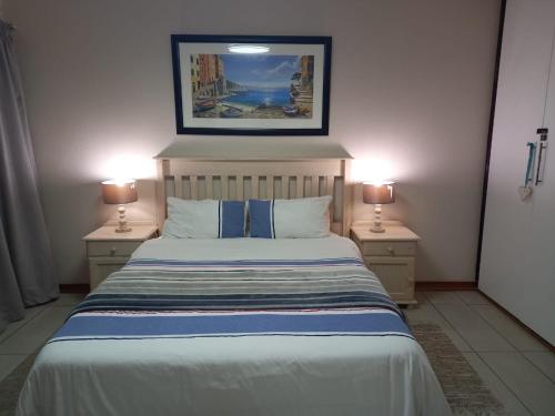 Ένα ή περισσότερα κρεβάτια σε δωμάτιο στο Holiday unit 37 Eden dunes