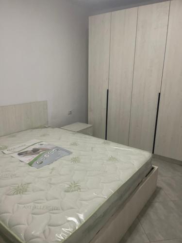 a bedroom with a bed in a room at Jonis Apartment in Vlorë