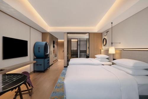 Postel nebo postele na pokoji v ubytování Renaissance Beijing Haidian Hotel