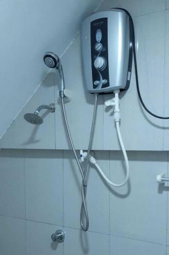 a shower in a bathroom with a shower at Lilly Rooms in Kandy